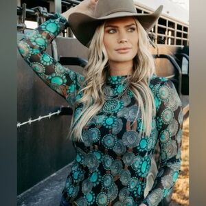 Queen of Style! A stylish mesh of shirt featuring Concho belts.